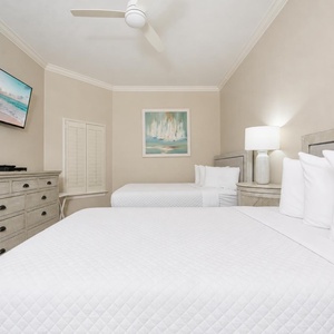 Drift into peaceful slumber on plush queen bedding, with a large TV ready for family movie nights just a click away