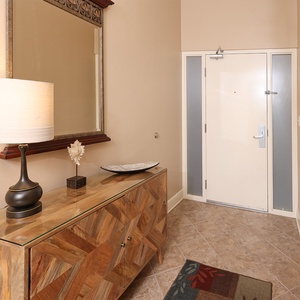 Step into a welcoming entryway, where stylish decor sets the tone for your relaxing beach getaway experience