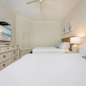 Unwind in this queen guest suite and stream your favorite shows or enjoy a good movie after a beach day