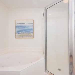 Indulge in relaxation in the master bath with a refreshing walk-in shower and soothing jetted tub