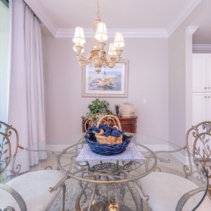 Indulge in warm evenings at the charming dining table, savoring laughter and shared moments with loved ones