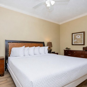 Relax in this serene king guest suite, where plush bedding beckons you to drift into restful slumber