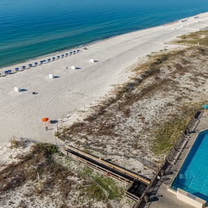 Relax by the poolside, enjoying the inviting grandual entry pool and easy access to the beach just steps away