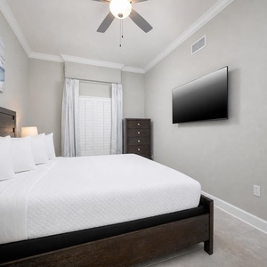 Relax on the cozy king bed in this guest suite and stream your favorite shows after a beach day
