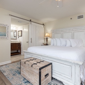 Unwind in this serene master bedroom featuring a king bed, stylish decor, and access to the master bath