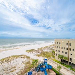 Enjoy panoramic views of the pristine beach and playful waterslide from this inviting coastal retreat