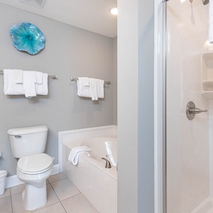Indulge in relaxation in the master bath with a refreshing walk-in shower and soothing jetted tub