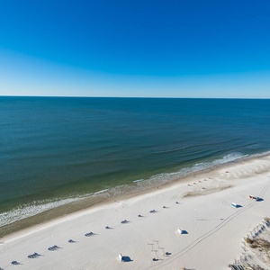Experience seemingly endless coastline views of the horizon as waves lap the shore and the sun glistens over the water