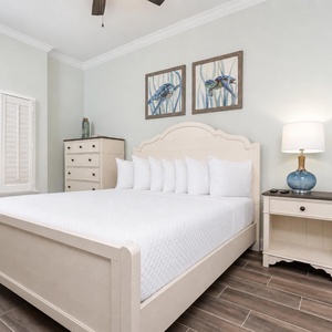 Unwind on the fluffy king bed beneath fun turtle artwork in the guest suite and enjoy a calm gulf coast night