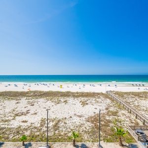 Breathe in the fresh coastal air while relaxing on your balcony, soaking in vibrant beach views and brilliant skies