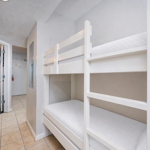 Cozy bunk area in the hallway for kids to enjoy relaxing after a day of adventure