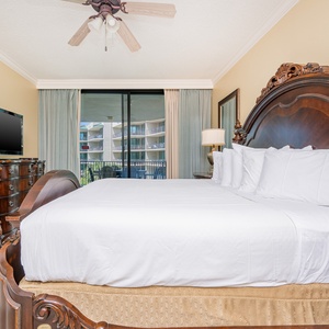 Unwind after a fun vacation day and stream your favorite shows in the king master suite with balcony access