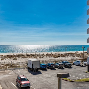 Enjoy breathtaking beach views from this inviting balcony, perfect for relaxation and soaking in the scenery