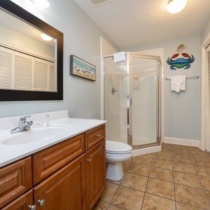 Refresh in this additional guest bath with a walk-in shower and laundry area with a washer and dryer in your rental