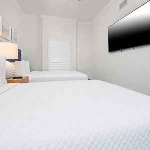 Unwind in this queen guest suite and stream your favorite shows or enjoy a good movie after a beach day