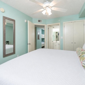 Tranquil bedroom with a comfortable king bed, a TV, and easy access to the adjoining bathroom