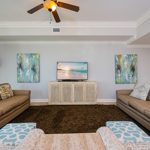 Unwind on the plush sofa with a queen sleeper while enjoying your favorite shows in this cozy living room