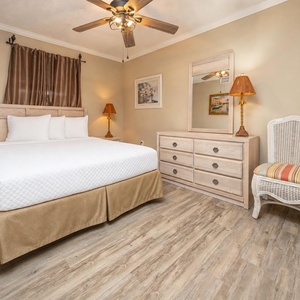 Soft lamp light welcomes you to the queen suite where you prepare for restful nights and bright mornings