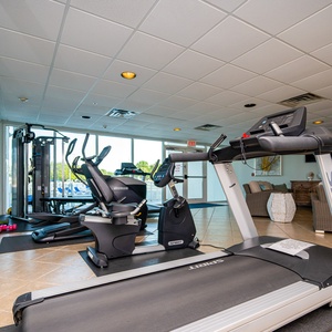 Stay active in the fitness center with modern equipment and a view at The Pass, perfect for your wellness routine