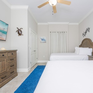 Unwind in this queen guest suite and stream your favorite shows or enjoy a good movie after a beach day