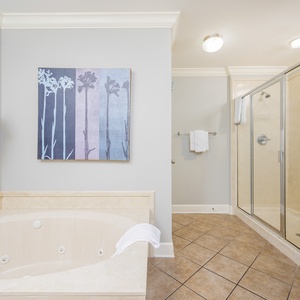 Refresh in the master bath after a day at the beach with a soothing jetted tub and relaxing walk-in shower