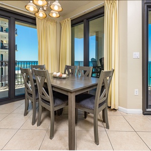Gather around the dining table with your family as sunlight warms the tile floor and gulf views stretch beyond
