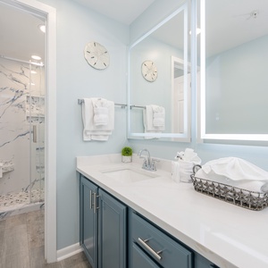Bright master bath with marble shower invites you to refresh and rejuvenate during your stay