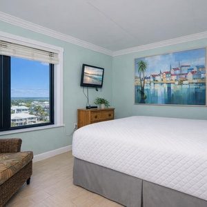 Drift into relaxation in this inviting guest bedroom, where a plush king bed and vibrant views create a serene retreat