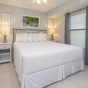 Cozy master bedroom featuring a plush king bed, stylish decor, and soft lighting for a relaxing retreat
