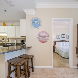 Prepare meals in this inviting kitchen, featuring stainless appliances and a cozy breakfast bar
