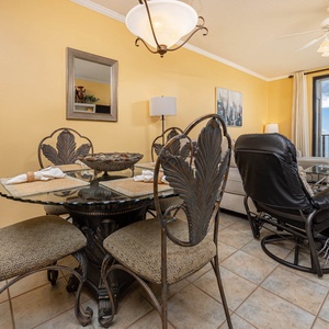 Dine at the elegant glass table while enjoying the inviting atmosphere and views from the spacious living area