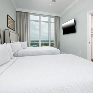 Unwind in this queen guest suite and stream your favorite shows or enjoy a good movie after a beach day