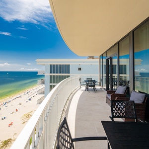 Enjoy the spacious balcony with comfortable seating, perfect for soaking in the stunning views and fresh gulf air
