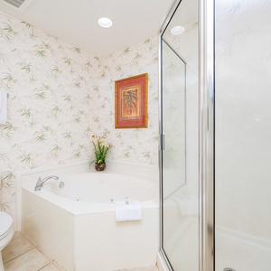 Indulge in relaxation in the master bath with a refreshing walk-in shower and soothing jetted tub