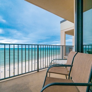 Sit back and enjoy the soothing views from your balcony, where beach life unfolds beneath tranquil skies