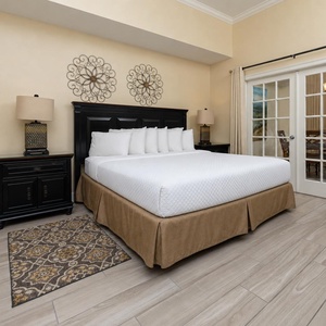 Experience tranquil mornings in the soft embrace of the cozy king bed in the master, with views that invite relaxation