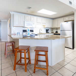 Spacious kitchen bar with seating, perfect for casual meals or coffee and enjoying the open layout