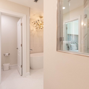 The master bath features elegant fixtures, a soaking tub, and a stylish walk-in shower, creating a serene retreat