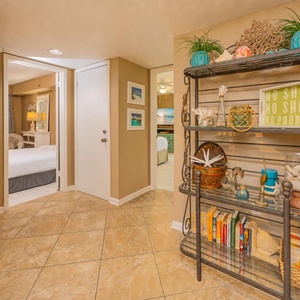 Tiled floors guide your steps past beach-inspired decor toward restful guest suites brightened by warm lamps
