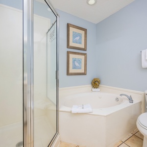 Indulge in relaxation in the master bath with a refreshing walk-in shower and soothing jetted tub