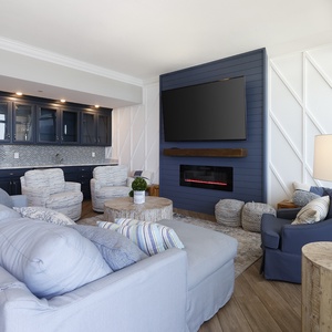 Sink into plush seating with a captivating view, enjoying cozy moments by the fireplace and soothing decor