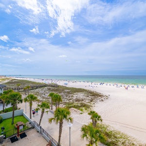 Gaze at the expansive shoreline and sparkling waters, perfect for a relaxing day by the beach