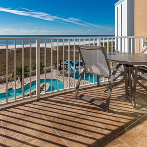 Bask in sunlight on the balcony while enjoying stunning coast views and the sounds of laughter from the pool below