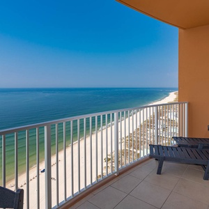 Breathe gulf air on the balcony chaise and watch the beachfront stretch below