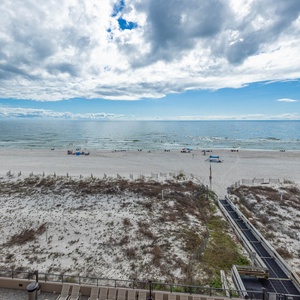 Take in the expansive views of the beach and water from your comfortable outdoor seating area