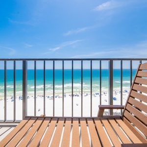 Wooden chair on your balcony invites you to enjoy the sound of surf and seagulls overhead