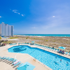 Bask in the sun by the pool while enjoying vibrant beach vibes and making cherished memories with family