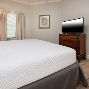 Sink into plush bedding as you unwind while streaming your favorite shows in the king master suite
