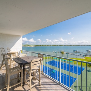 Relax and unwind on your balcony while enjoying stunning views of the lagoon and nearby tennis courts
