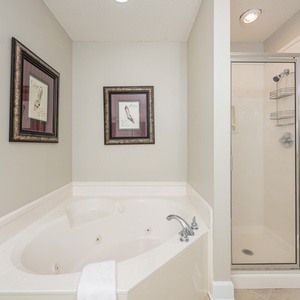 Indulge in relaxation in the master bath with a refreshing walk-in shower and soothing jetted tub